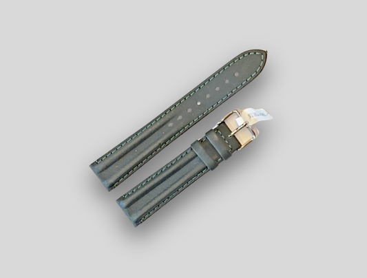 Gray watch strap with gold clasp on a light gray background