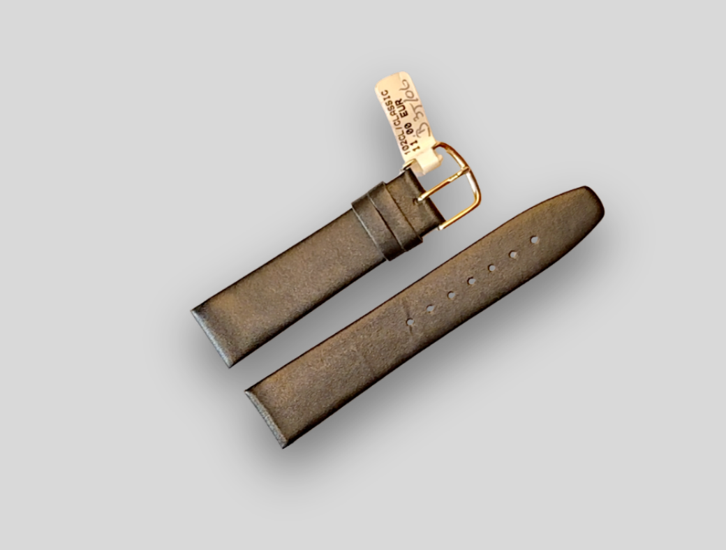 Brown leather watch strap with gold buckle on a light gray background