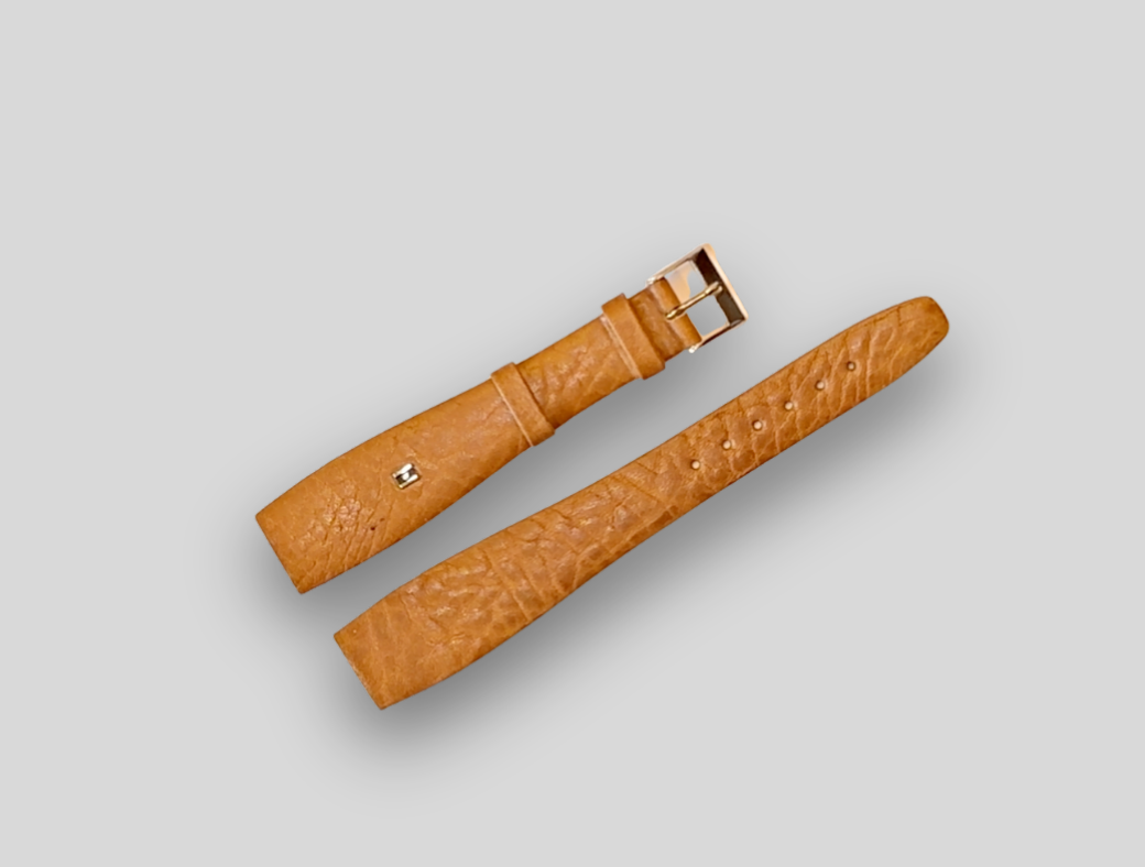 Brown leather HIRSCH watch strap with gold buckle on a light gray background