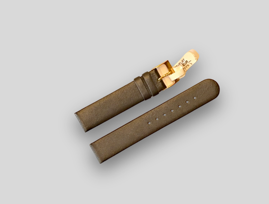 HODERS Brown leather watch strap with gold buckle on a light gray background