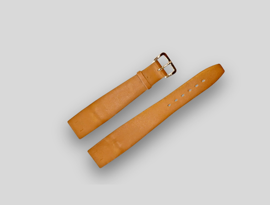 Brown leather watch strap on a light gray background