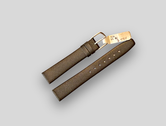 Brown leather belt with gold buckle on a light gray background