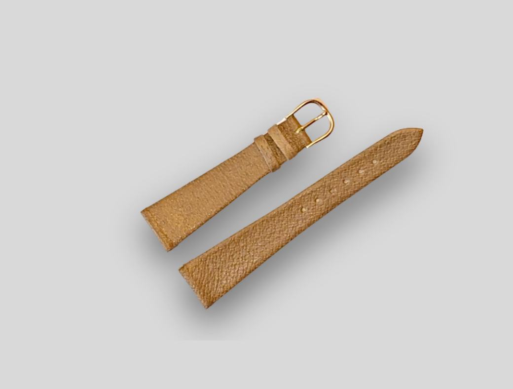 Brown leather watch strap on a light gray background
