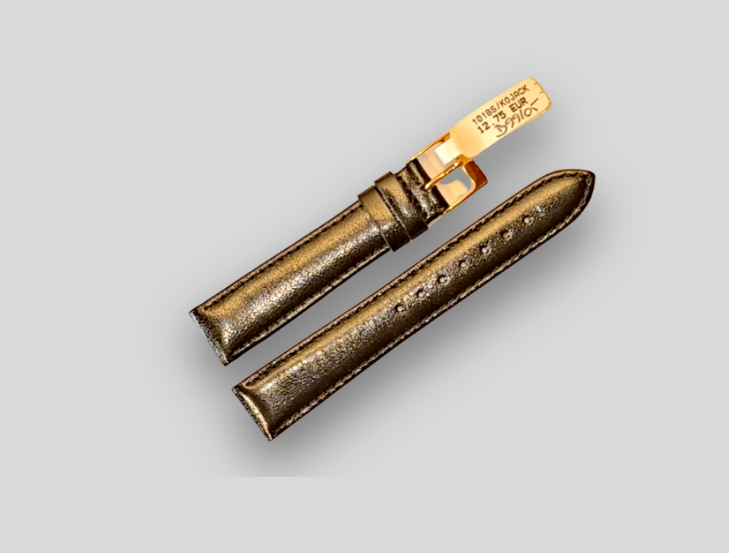 Bronze-colored watch strap on a light gray background