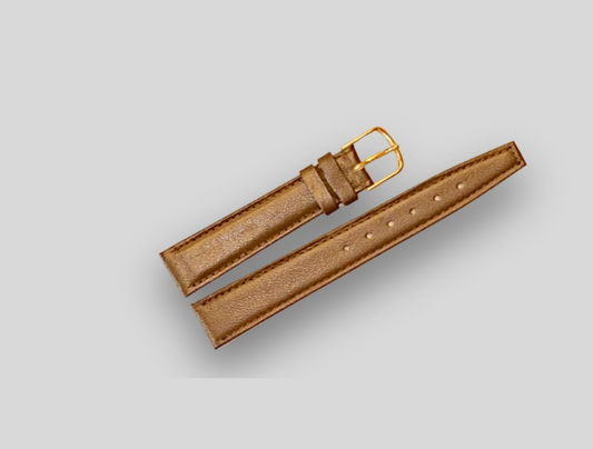 Brown leather watch strap with gold buckle on a light gray background