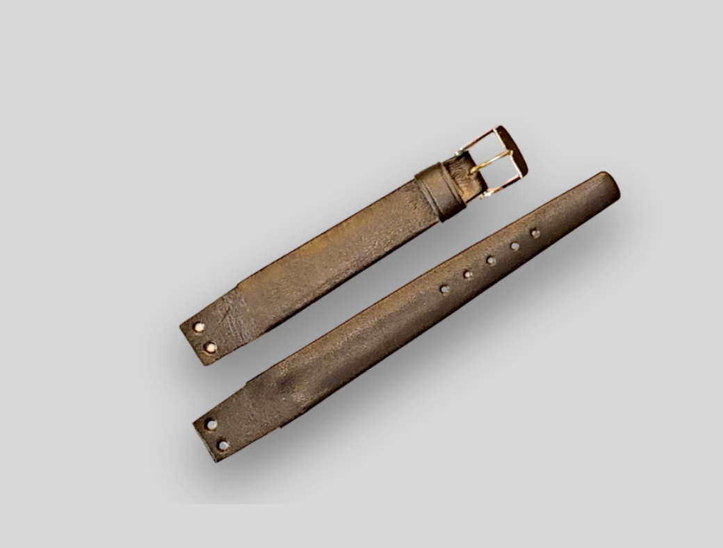 Brown leather watch strap on a light gray background