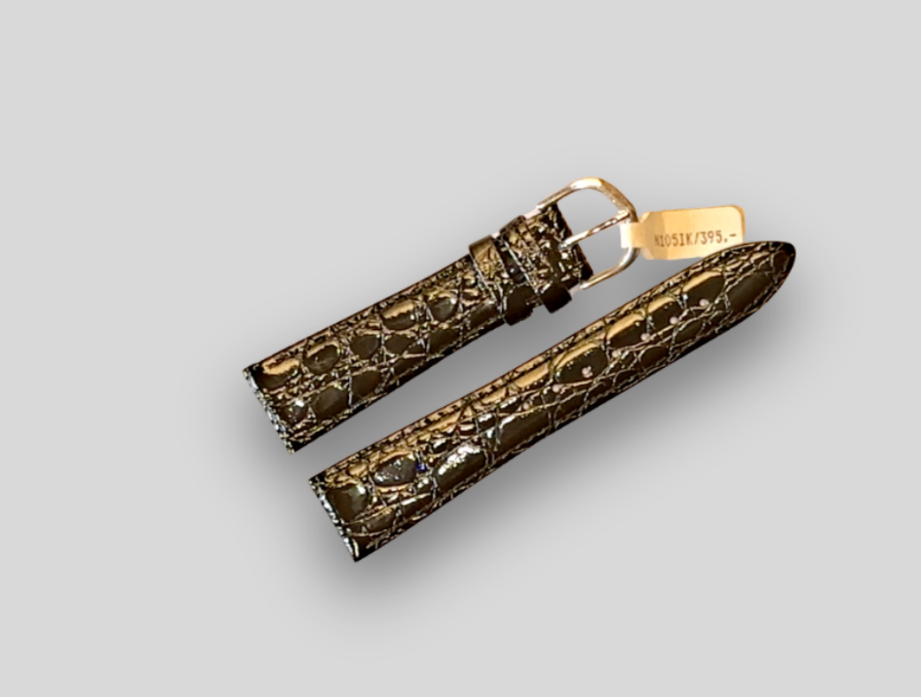 Gold and brown patterned watch strap on a light gray background