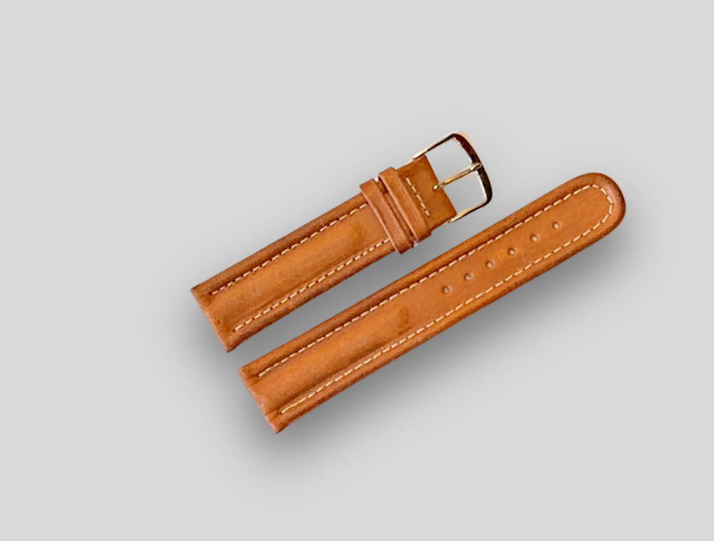Brown leather watch strap on a light gray background