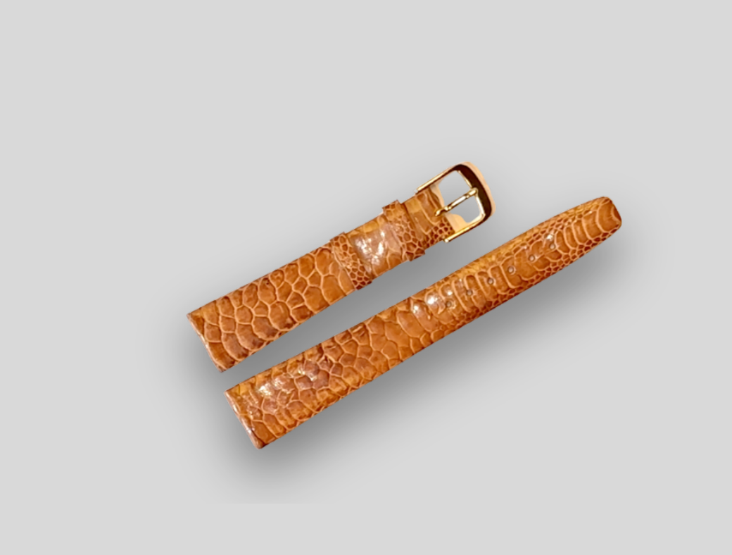 Brown crocodile-patterned watch strap on a light gray background