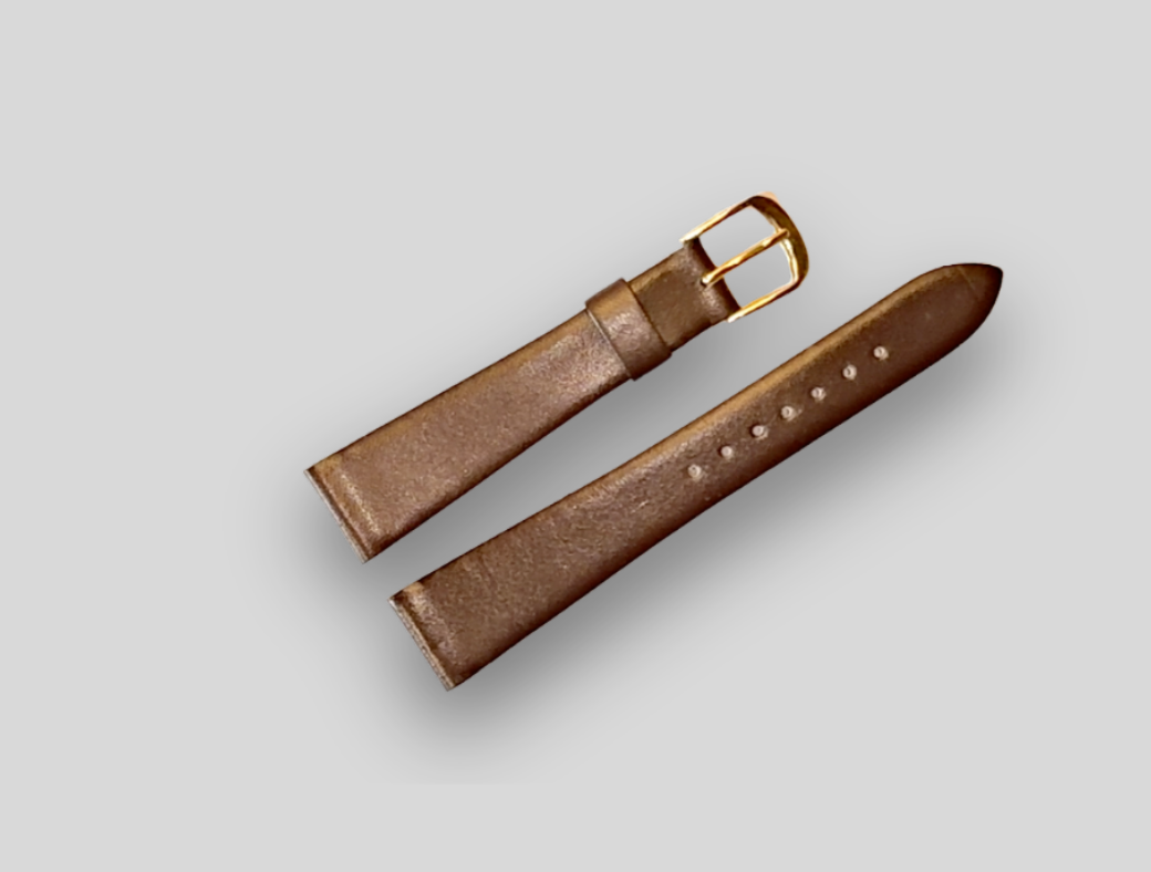 Brown leather watch strap with gold buckle on a light gray background