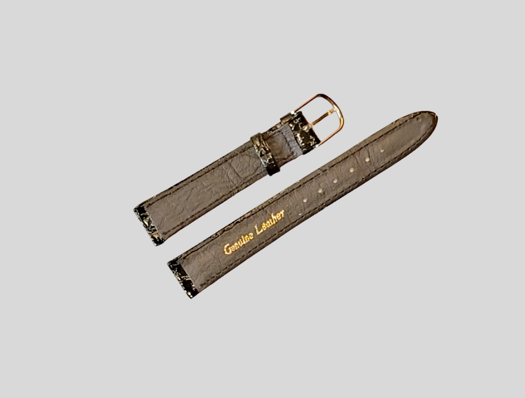 Brown watch strap with gold buckle on a light gray background